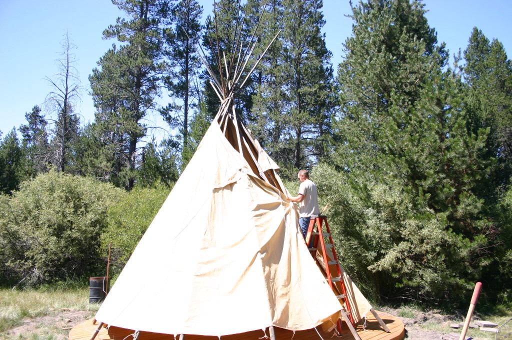 putting canvas on teepee